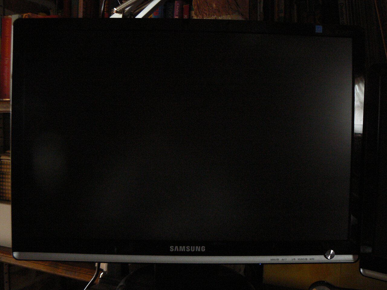 A Samsung computer monitor with the screen off — a different model, not the 49-inch ultrawide in this deal