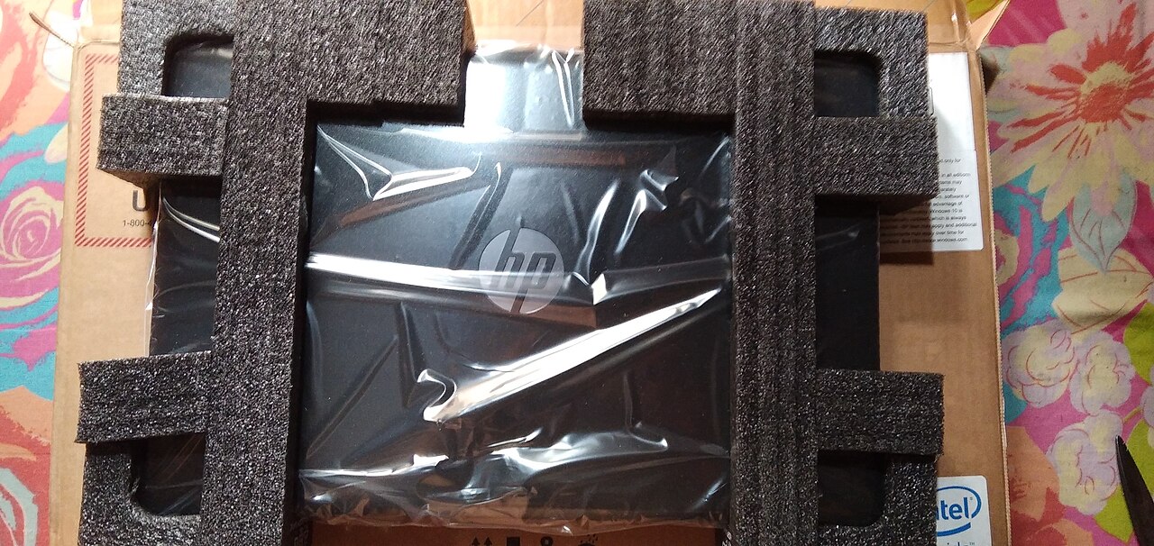 An HP laptop in its packaging, the HP logo on the lid — a different model series from the 15-fd0016ca in this deal