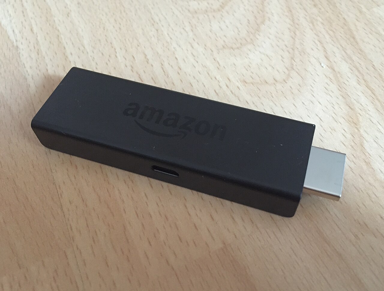 An Amazon Fire TV Stick with its HDMI connector visible — another model in the line, not the 4K Select in this deal